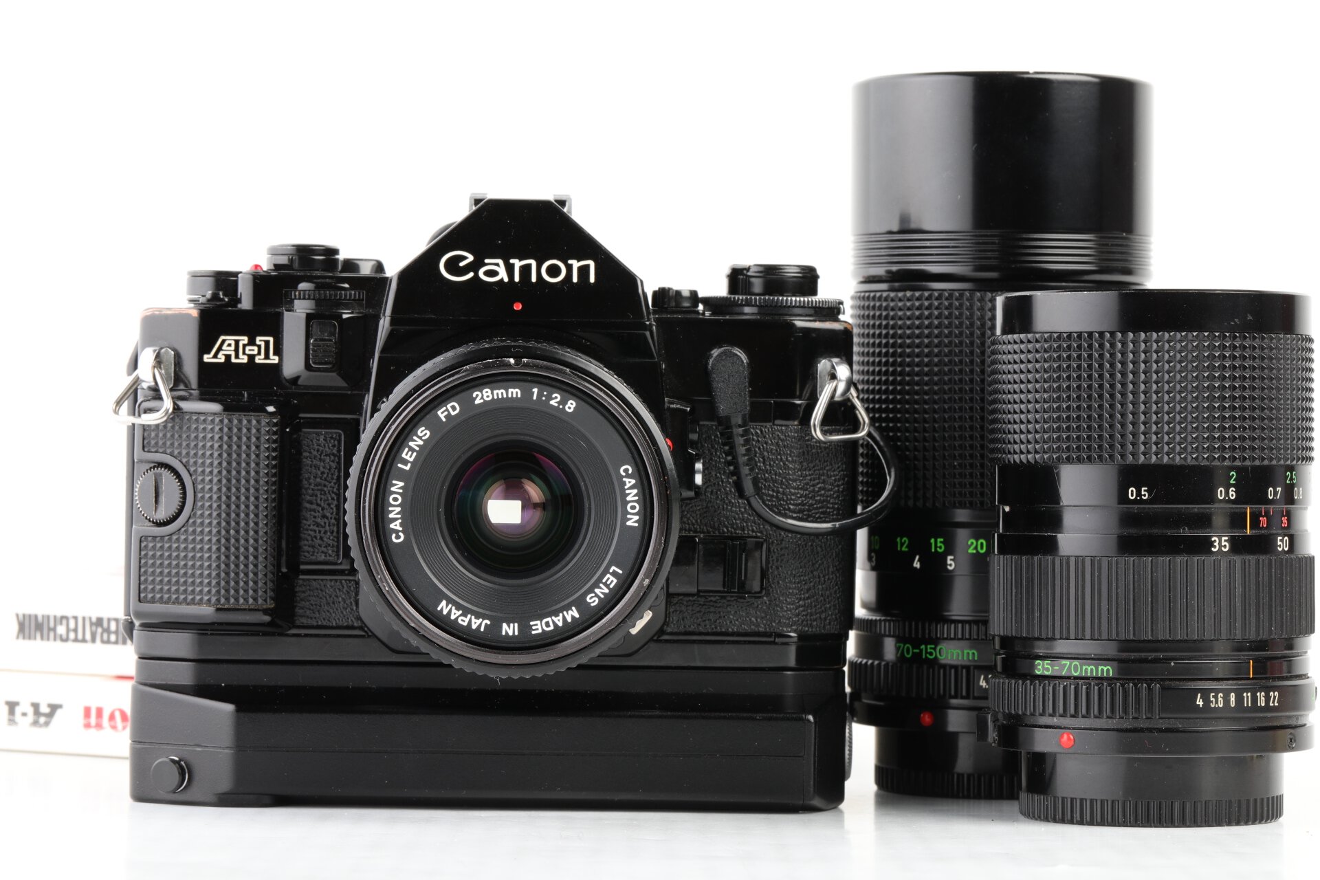 Canon A-1 +Power Winder A2 + FD 28mm f2,8 + FD 35-70 f4  + FD 70-150mm f4,5 + Data Back A